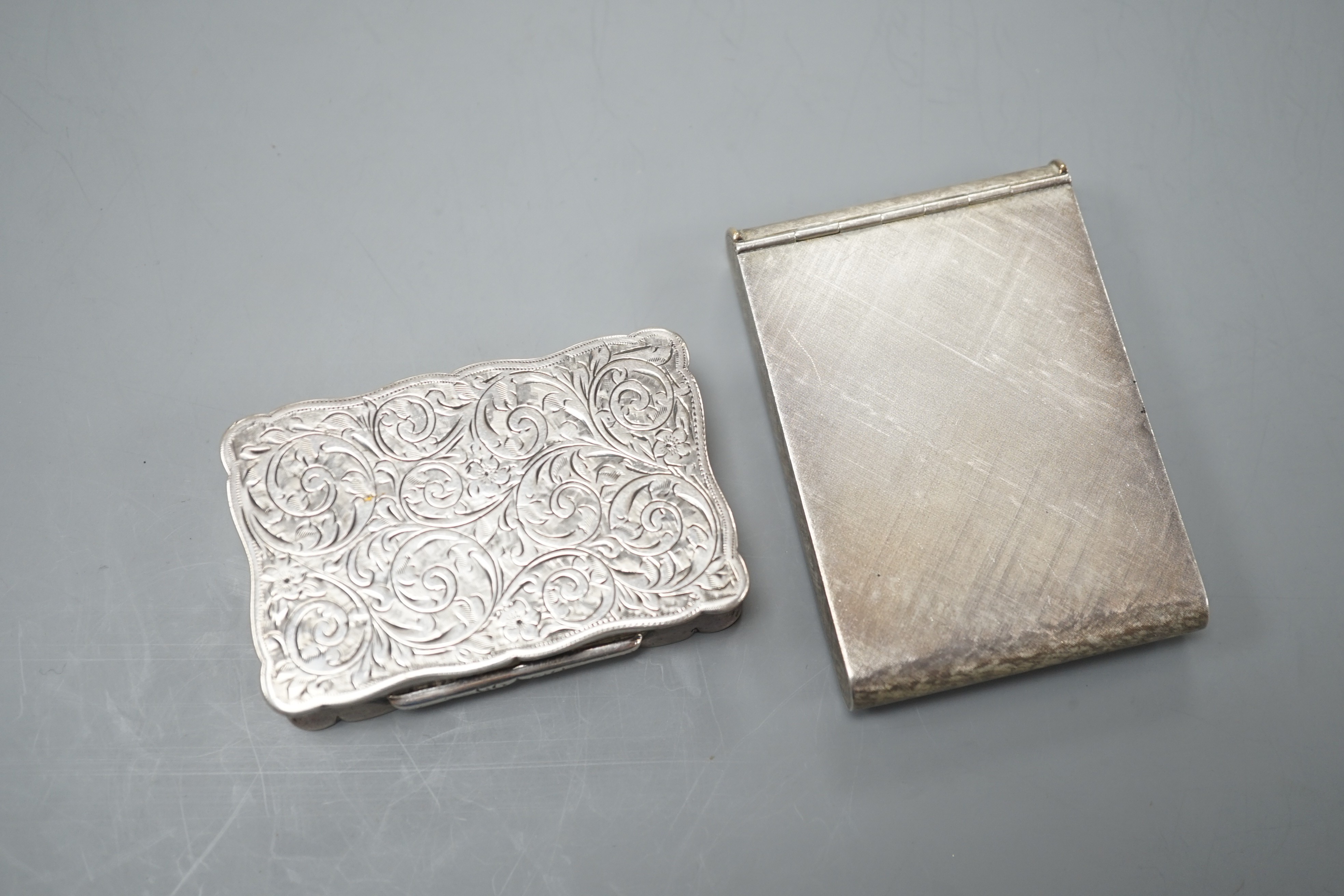 A George V engraved silver snuff box, Joseph Gloster Ltd, Birmingham, 1913, 71mm, with engraved inscription, together with and Italian brushed 925 and 750 cigarette case.